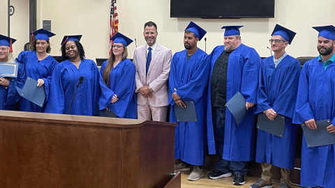 Senior Resident Superior Court Judge Jason Disbrow (center) with July 27 Recovery Court Graduates.